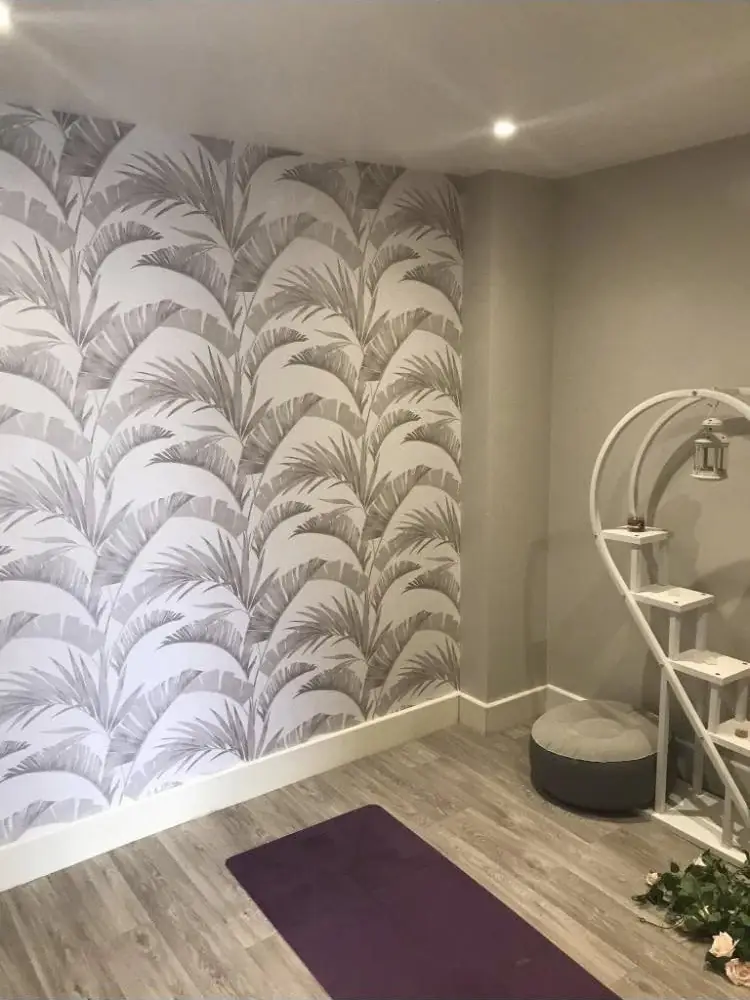 Botanical print wallpaper hung as a feature wall in an Andover hallway with a pale carpet